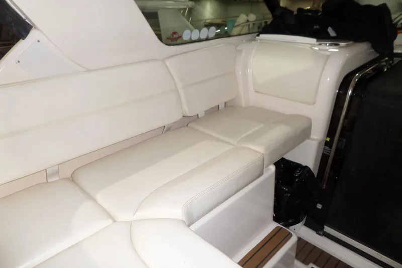Slide: The Image of 2006 Tiara Yachts 3600 Sovran interior seating with cream upholstery and sleek design. - 14