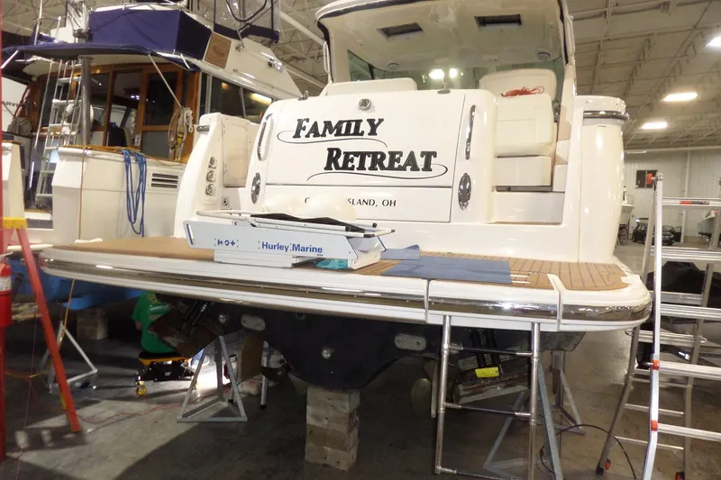 Slide: The Image of 2006 Tiara Yachts 3600 Sovran "Family Retreat" docked indoors, featuring a spacious deck. - 2