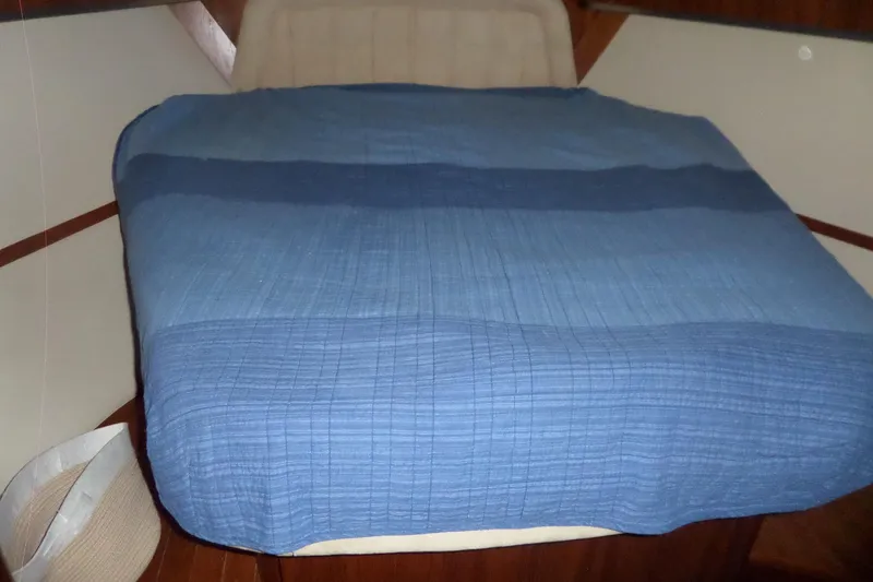 Slide: The Image of Interior cabin of 2006 Tiara Yachts 3600 Sovran with blue bedding. - 28