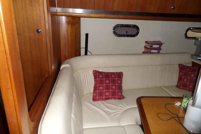 Slide: The Image of Luxurious interior of 2006 Tiara Yachts 3600 Sovran with cream seating and nautical decor. - 29