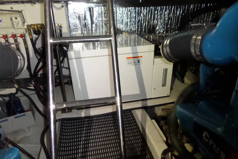 Slide: The Image of Engine room of 2006 Tiara Yachts 3600 Sovran with visible machinery and ladder. - 39