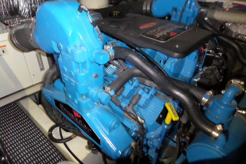 Slide: The Image of Engine compartment of a 2006 Tiara Yachts 3600 Sovran, featuring a blue marine engine. - 41