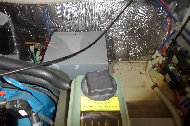 Slide: The Image of Engine compartment of a 2006 Tiara Yachts 3600 Sovran with visible wiring and components. - 42