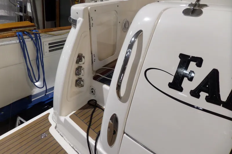 Slide: The Image of 2006 Tiara Yachts 3600 Sovran boat deck with chrome accents and nautical ropes. - 5