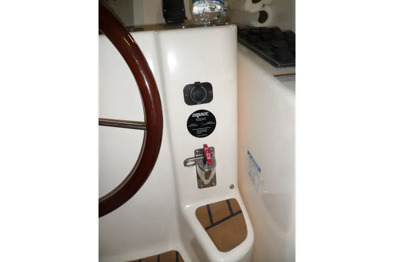 Slide: The Image of 2006 Tiara Yachts 3600 Sovran helm detail with steering wheel and control panel. - 51