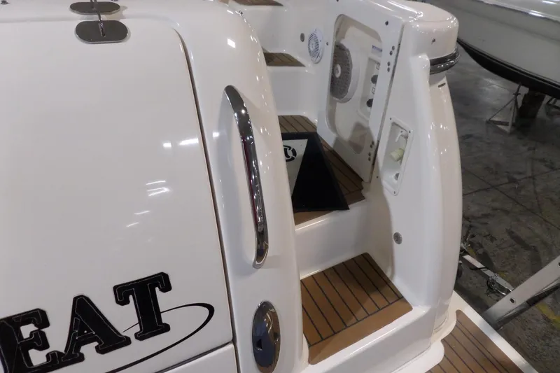 Slide: The Image of 2006 Tiara Yachts 3600 Sovran boat deck with teak steps and chrome accents. - 6