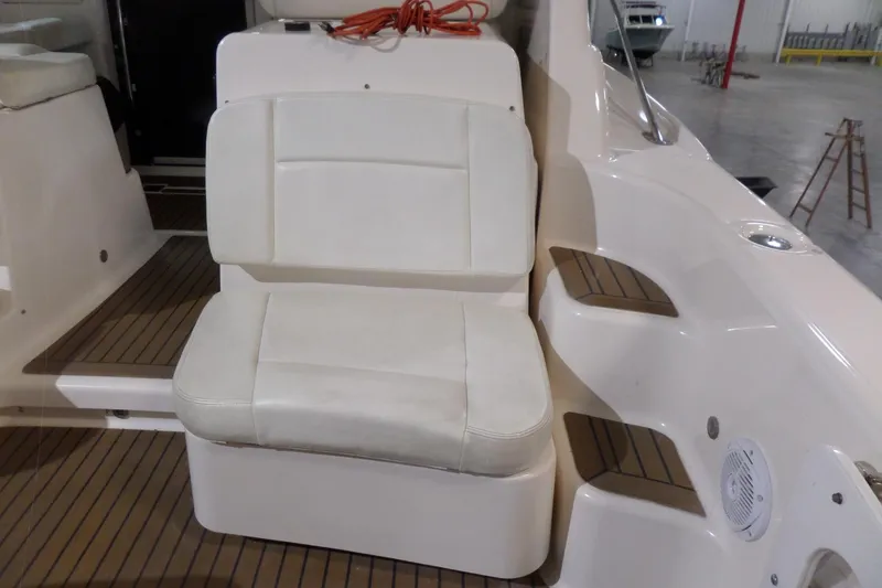 Slide: The Image of 2006 Tiara Yachts 3600 Sovran interior with white seating and teak flooring. - 7