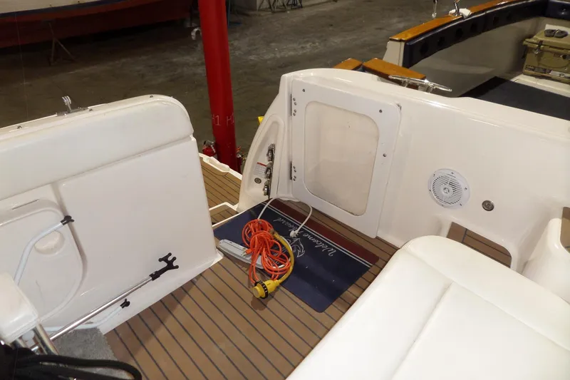 Slide: The Image of 2006 Tiara Yachts 3600 Sovran interior with seating, storage, and marine equipment. - 9