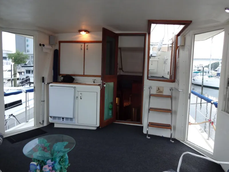 Slide: The Image of Interior of a 1987 Hatteras 43 yacht with harbor view. - 22