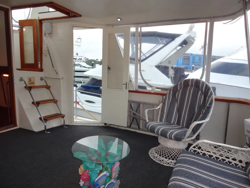 Slide: The Image of Interior of a 1987 Hatteras 43 yacht with cozy seating area. - 24