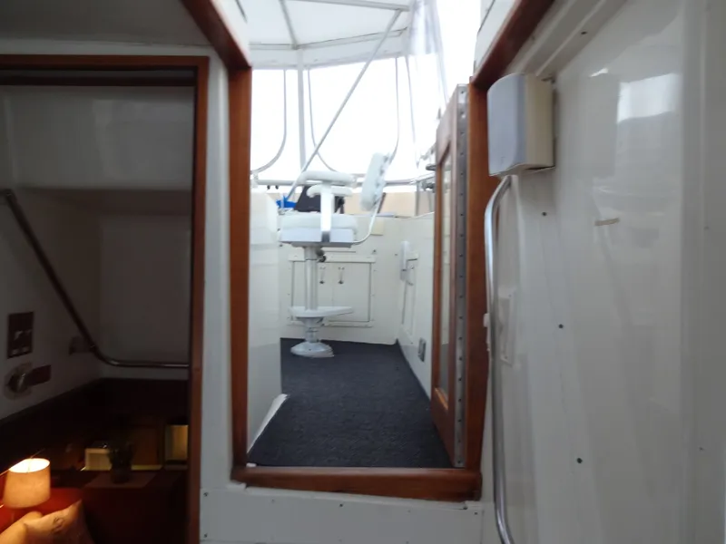 Slide: The Image of Interior of a 1987 Hatteras 43 yacht with helm station. - 32