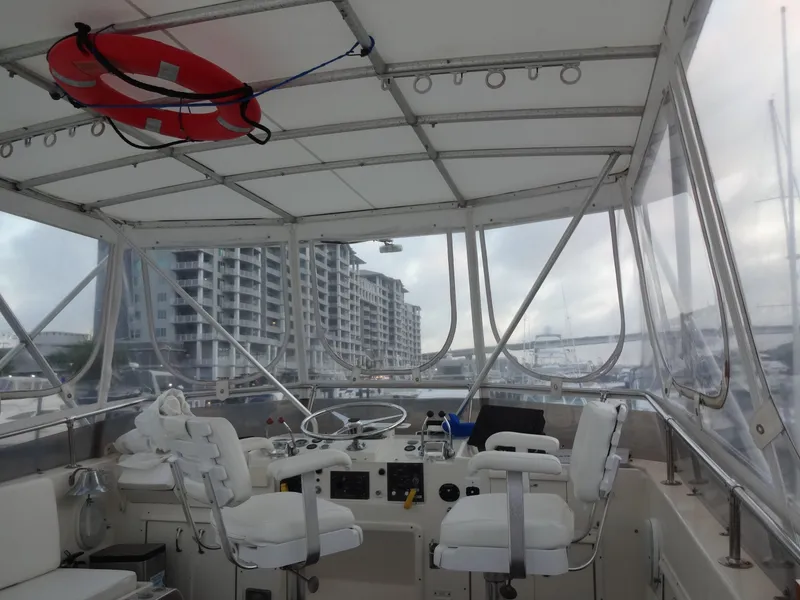 Slide: The Image of Interior view of a 1987 Hatteras 43 yacht with helm station. - 33