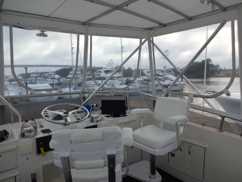 Slide: The Image of Interior view of 1987 Hatteras 43 yacht helm station. - 36