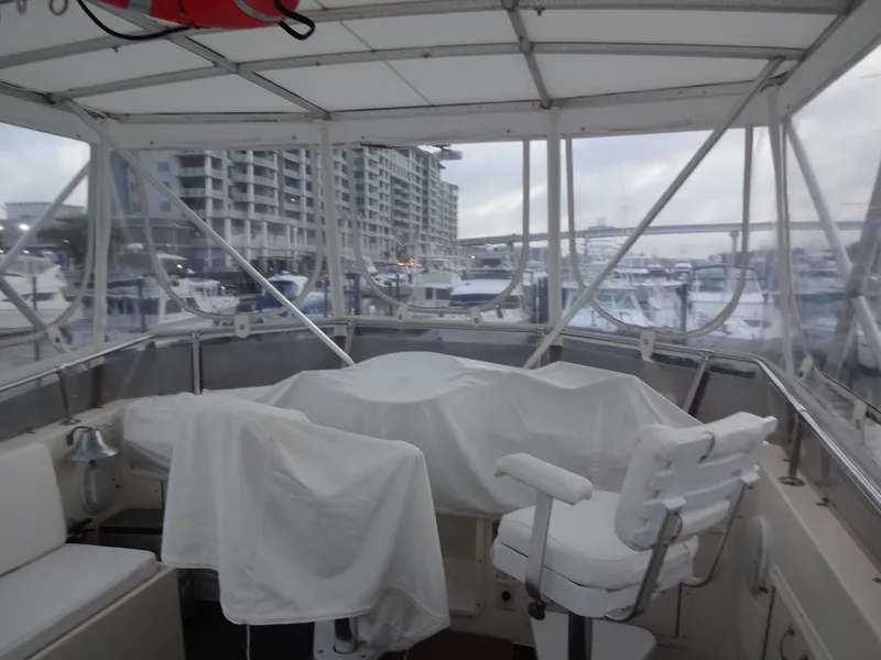 Slide: The Image of Interior of a 1987 Hatteras 43 yacht docked at marina. - 40