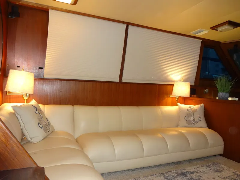 Slide: The Image of 1987 Hatteras 43 yacht interior with leather sofa. - 43