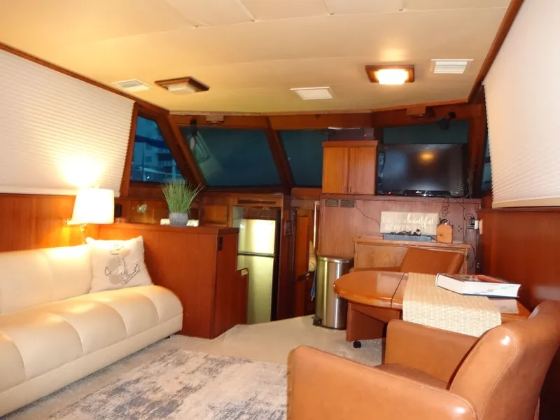 Slide: The Image of Interior of a 1987 Hatteras 43 yacht with cozy living area. - 44