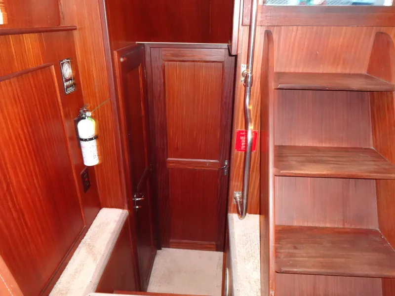 Slide: The Image of Interior of a 1987 Hatteras 43 yacht with wooden paneling. - 48