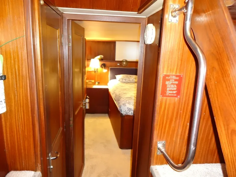 Slide: The Image of Interior of a 1987 Hatteras 43 yacht, bedroom view. - 49