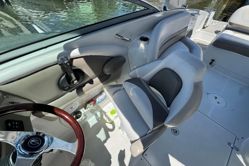 Slide: The Image of Interior of 2013 Crownline Eclipse E6 XS boat with steering wheel and seating. - 13