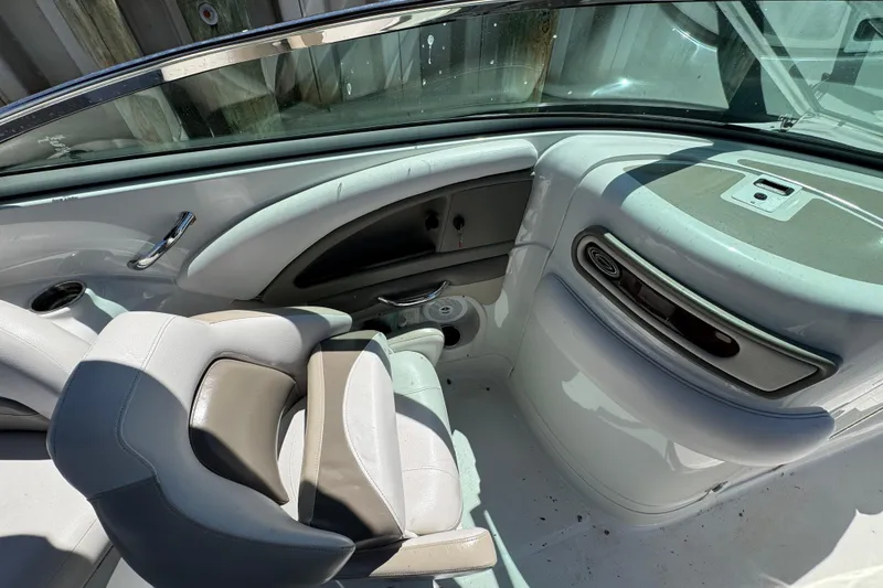 Slide: The Image of Interior of 2013 Crownline Eclipse E6 XS boat with seating and dashboard details. - 14