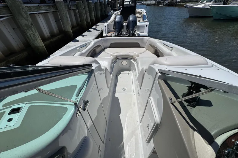 Slide: The Image of 2013 Crownline Eclipse E6 XS boat interior with spacious seating and sleek design. - 17