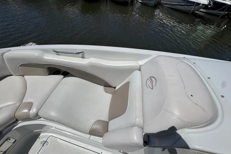 Slide: The Image of 2013 Crownline Eclipse E6 XS boat interior with white and beige seating. - 18
