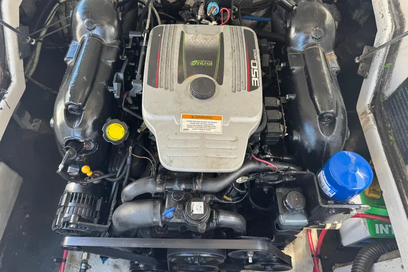 Slide: The Image of Engine of a 2013 Crownline Eclipse E6 XS boat, featuring a 350 MAG motor. - 3