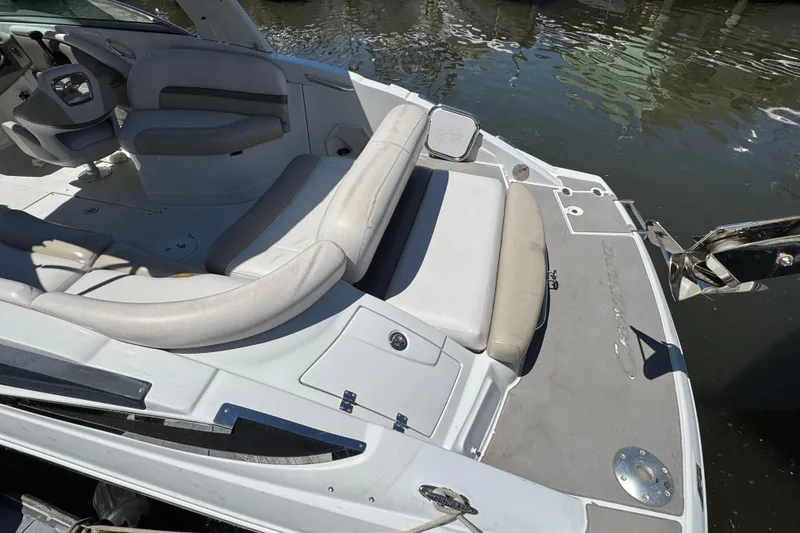 Slide: The Image of 2013 Crownline Eclipse E6 XS boat interior with seating and water view. - 4
