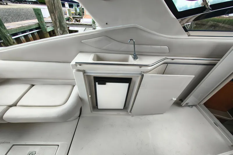 Slide: The Image of Interior of Regal Commodore 3260 yacht with sink and fridge. - 10