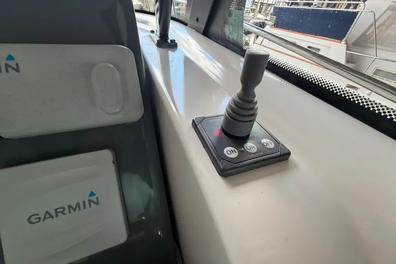 Slide: The Image of Control panel with joystick and Garmin device on 2002 Tiara Yachts 3800 Open. - 13