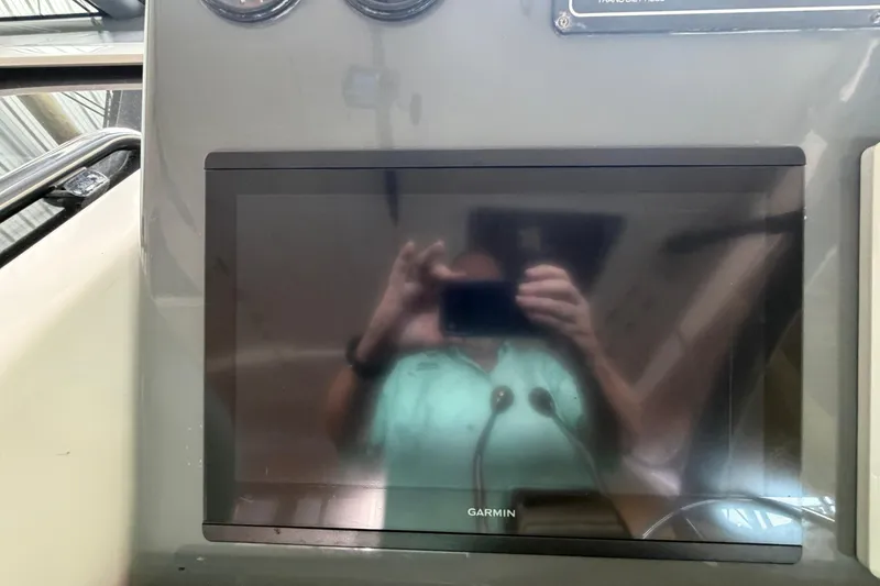 Slide: The Image of Dashboard of a 2002 Tiara Yachts 3800 Open with Garmin display. - 14
