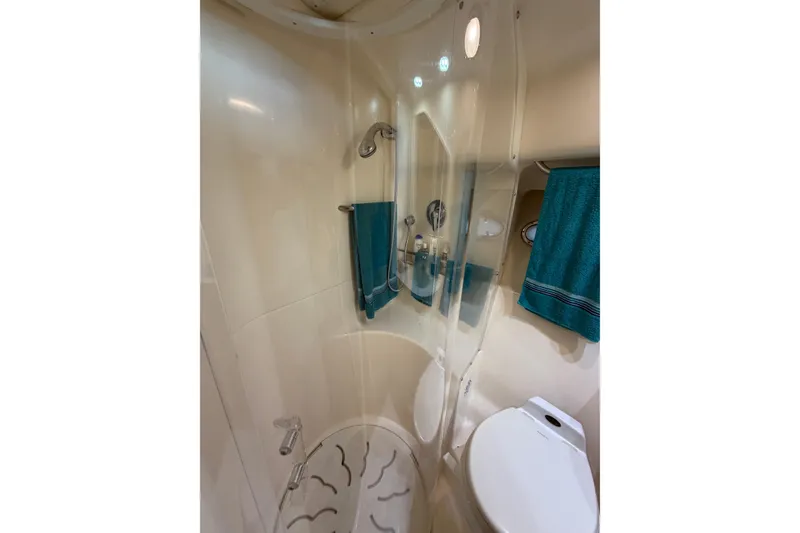 Slide: The Image of Bathroom interior of 2002 Tiara Yachts 3800 Open, featuring shower and toilet. - 19