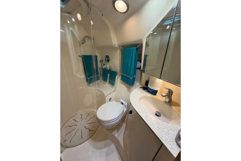 Slide: The Image of Bathroom interior of 2002 Tiara Yachts 3800 Open, featuring shower and sink. - 21
