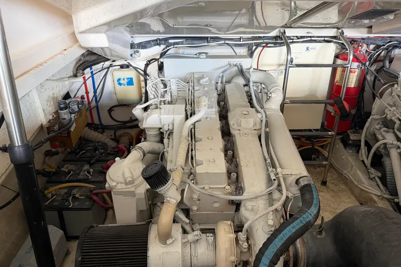 Slide: The Image of Engine room of a 2002 Tiara Yachts 3800 Open, showcasing mechanical components and wiring. - 31