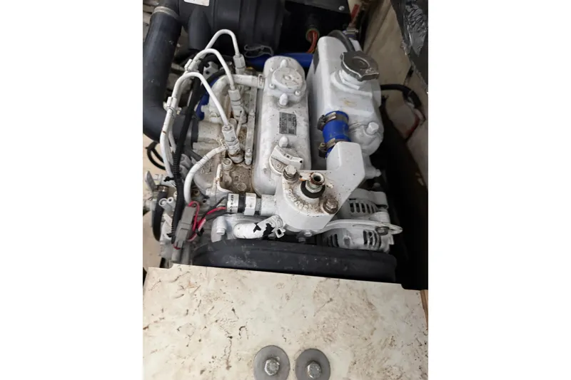 Slide: The Image of Engine of a 2002 Tiara Yachts 3800 Open, showcasing intricate mechanical components. - 33
