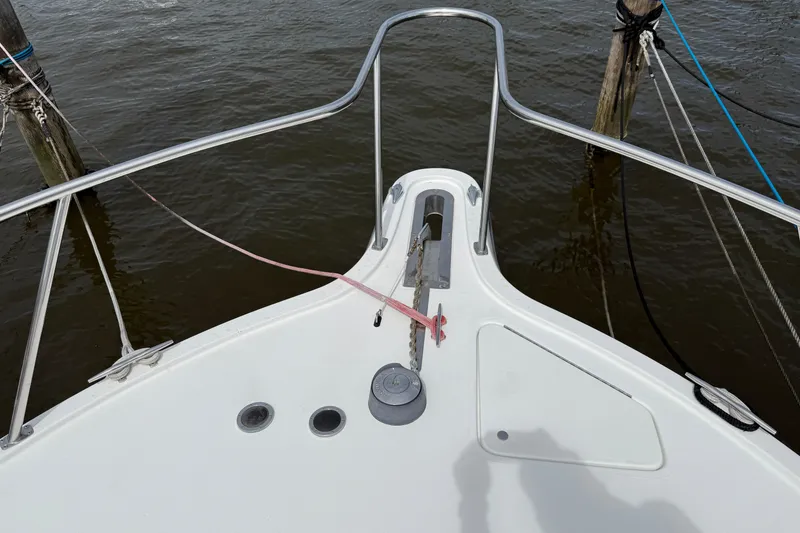 Slide: The Image of Bow of a 2001 Pursuit 3000 Offshore boat with anchor and railing. - 12
