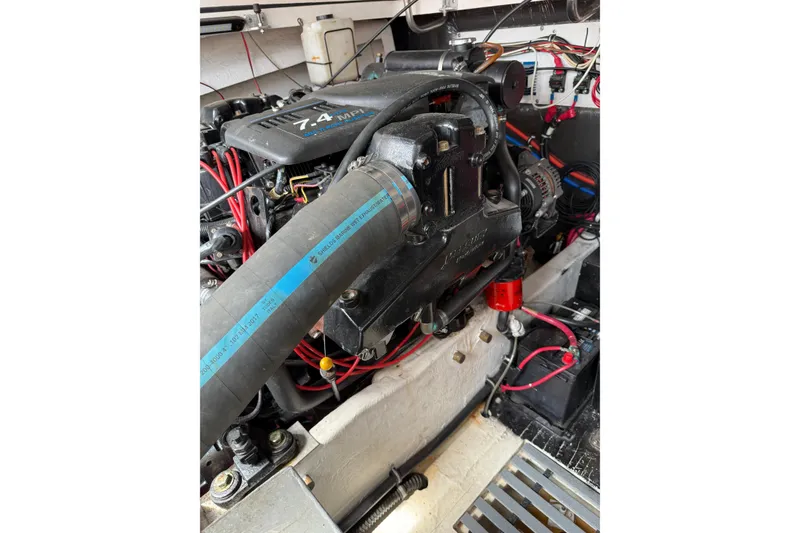 Slide: The Image of Engine compartment of a 2001 Pursuit 3000 Offshore boat, featuring a 7.4 MPI engine. - 18