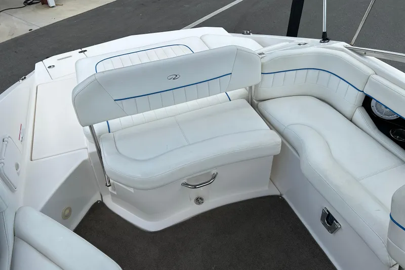 Slide: The Image of 2008 Regal 2520 FasDeck boat interior with white seating and blue accents. - 13