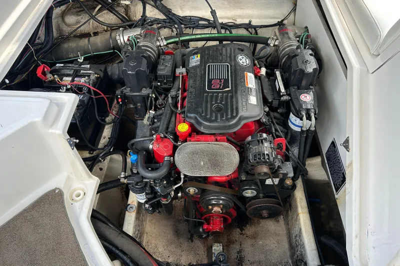 Slide: The Image of Engine compartment of a 2008 Regal 2520 FasDeck boat, showcasing detailed mechanical components. - 18