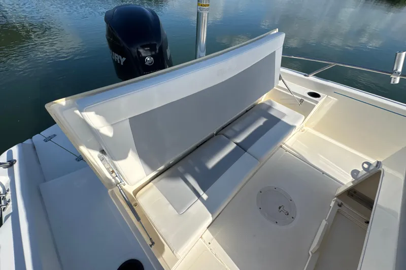 Slide: The Image of 2014 Boston Whaler 210 Dauntless boat with open seating and Mercury engine. - 26