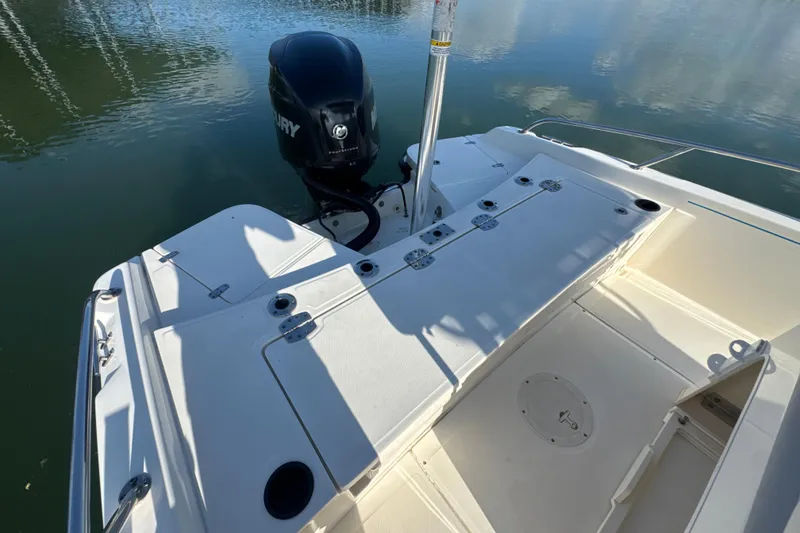 Slide: The Image of 2014 Boston Whaler 210 Dauntless boat deck with Mercury outboard motor. - 27