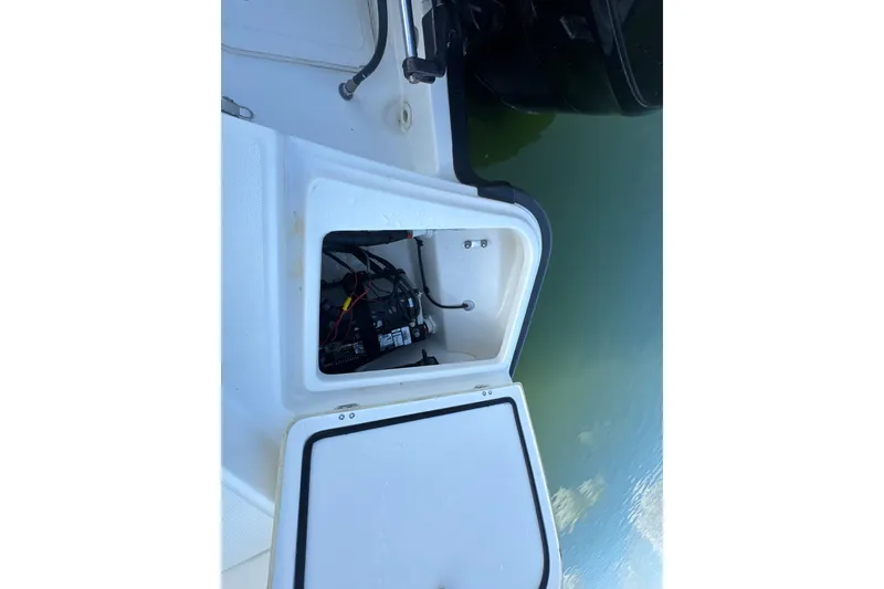 Slide: The Image of Open storage compartment on a 2014 Boston Whaler 210 Dauntless boat. - 29
