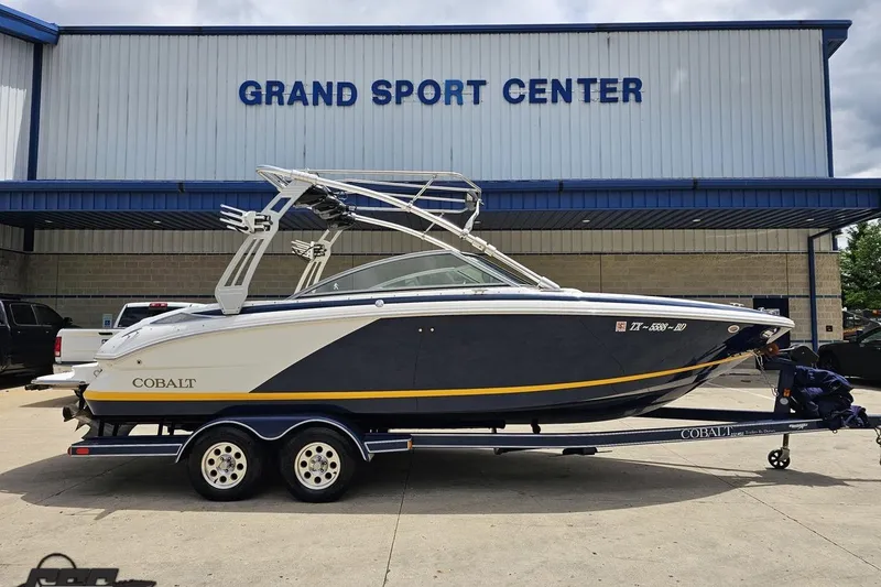 The Image of 2010 Cobalt 232 WSS boat on trailer at Grand Sport Center. - 1