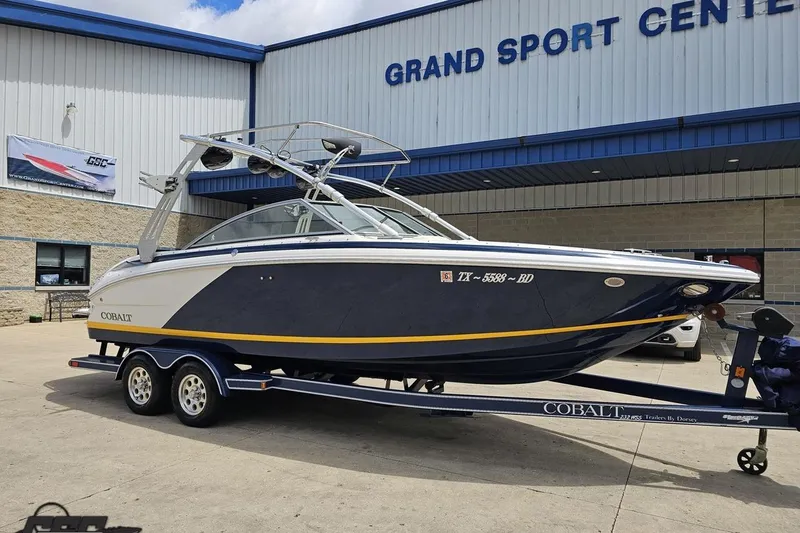 Slide: The Image of 2010 Cobalt 232 WSS boat on trailer at Grand Sport Center. - 14