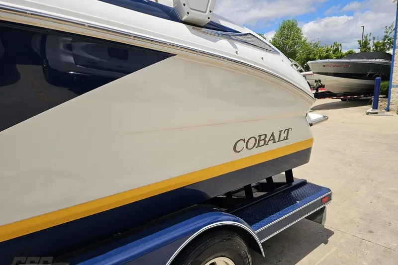 Slide: The Image of 2010 Cobalt 232 WSS boat on trailer, featuring sleek design and vibrant colors. - 26