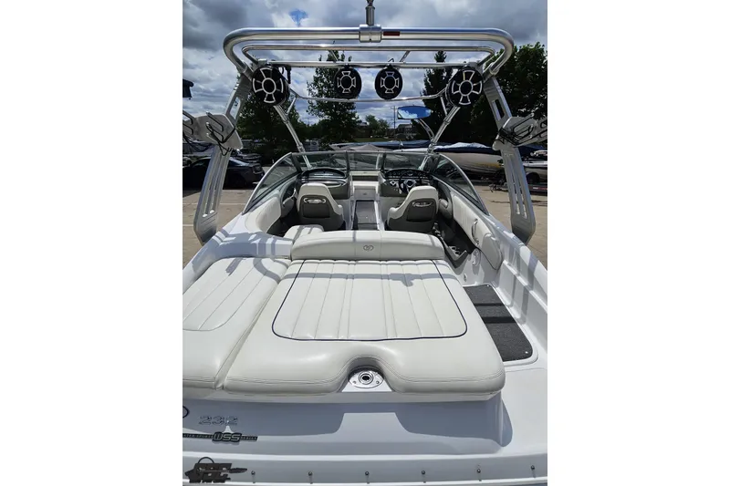 Slide: The Image of 2010 Cobalt 232 WSS boat interior with white seating and wakeboard tower. - 37