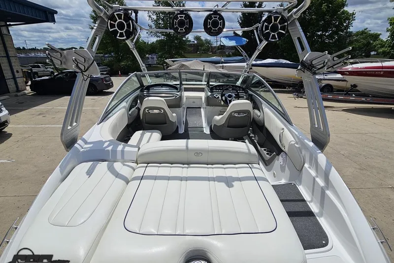 Slide: The Image of 2010 Cobalt 232 WSS boat interior with sleek seating and advanced audio system. - 38