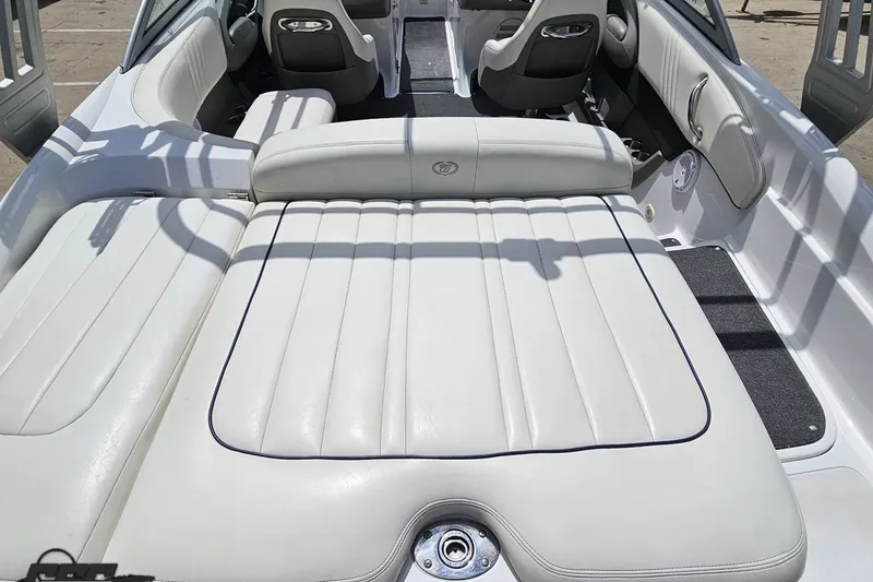 Slide: The Image of 2010 Cobalt 232 WSS boat interior with white leather seating and modern design. - 39