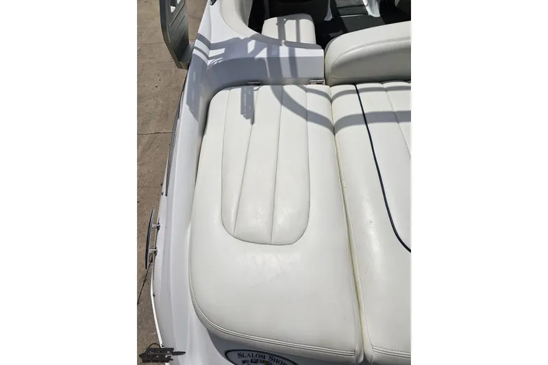 Slide: The Image of White leather seating on a 2010 Cobalt 232 WSS boat, showcasing luxury and comfort. - 41