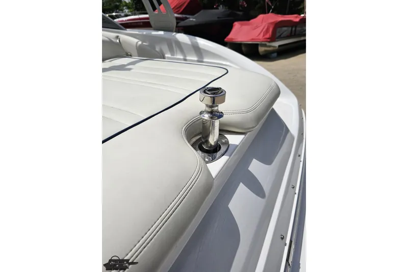Slide: The Image of 2010 Cobalt 232 WSS boat with white leather seating and chrome hardware. - 43